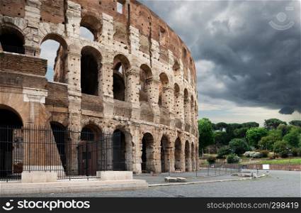 Gray thunder clouds over Colosseum in summer Rome