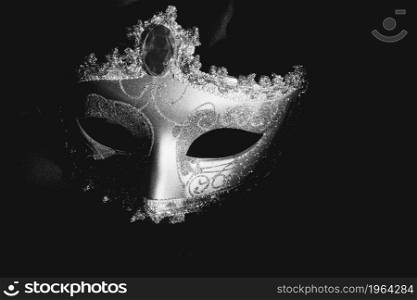 gray venetian mask dark background. High resolution photo. gray venetian mask dark background. High quality photo