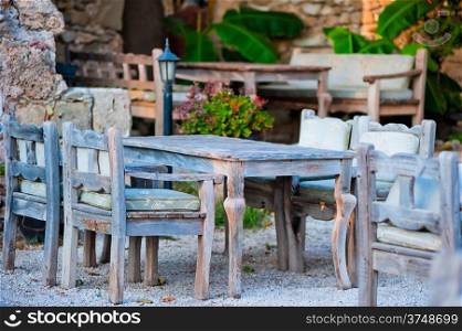gray wooden furniture in an outdoor restaurant