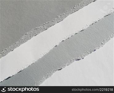 grayscale diagonal paper rips