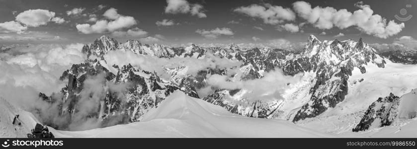 Grayscale. Mont Blanc rocky mountain massif summer view from Aiguille du Midi Mount, Chamonix, French Alps.