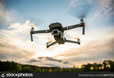 Graz, Austria 0105.2020 - DJI Drone Mavic 2 Pro with Hasselblad camera flying against blue sky. Copy space. Graz, Austria 01.05.2020 - DJI Drone Mavic 2 Pro with Hasselblad camera flying against blue sky.