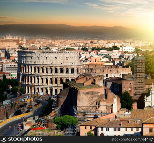 Great ancient colosseum in Rome at sunset, Italy