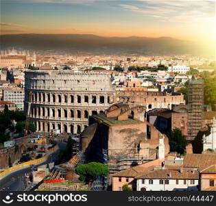 Great ancient colosseum in Rome at sunset, Italy