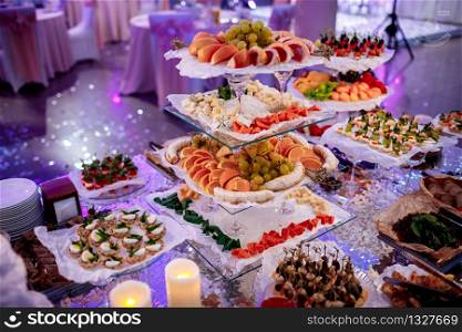 great attractive set of canapes with vegetables, cheese, fruits, berries, salami, seafood, meat and decoration on wedding.. great attractive set of canapes with vegetables, cheese, fruits, berries, salami, seafood, meat and decoration on wedding
