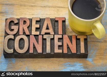 great content word abstract in vintage letterpress wood type with a cup of coffee