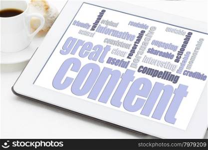 great content word cloud on a digital tablet with a cup of coffee - bloging and content marketing concept
