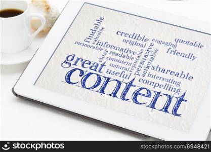 great content writing word cloud on a digital tbalet with a cup of coffee - business writing and content marketing concept