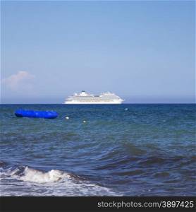 Great Cruise ship on the horizon, on the sea, blue sky, square image