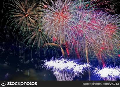 Great fireworks display at night on the occasion of the New Year. Close,horizontal view.