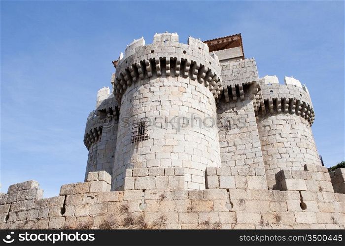 Great gray stone castle. A great strength under the blue sky