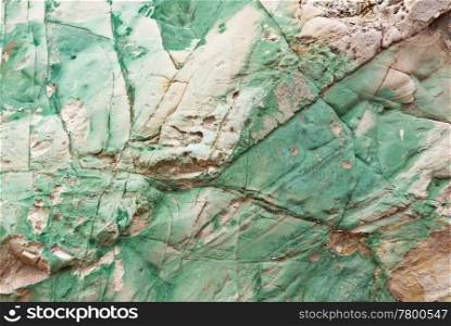 great green copper in stone wall background. copper in stone background