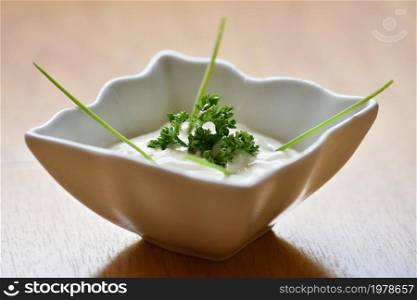 Great homemade tartar sauce in a bowl. Garnished with parsley.