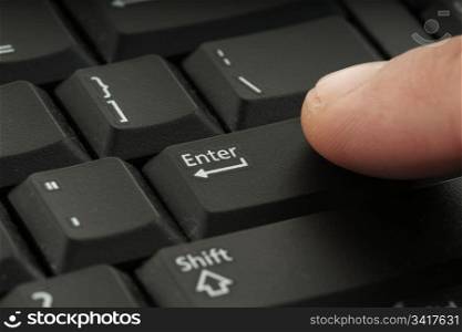 great image of a finger on computer keyboard