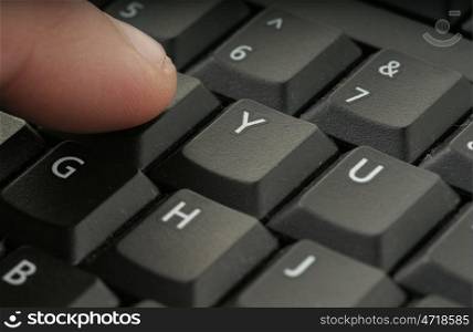 great image of a finger on computer keyboard