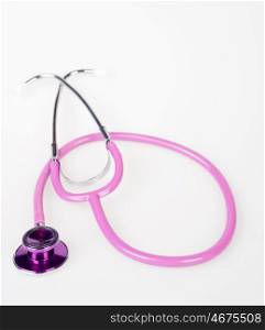 great image of a pink doctors stethoscope on white background