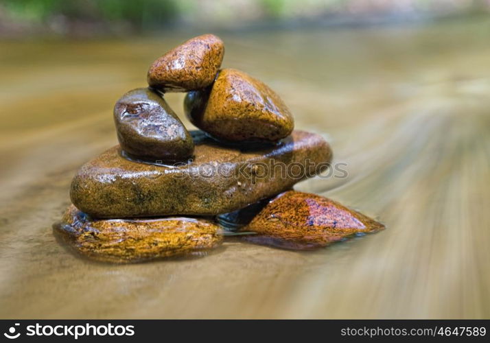 great image of a stack of rocks in a stream