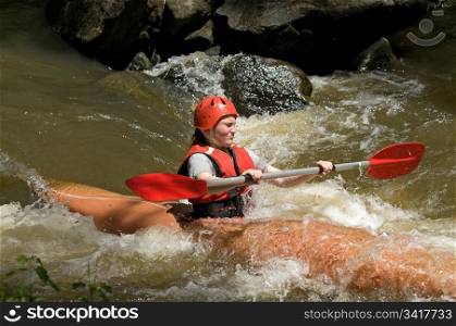 great image of a teenage girl white water kayaking