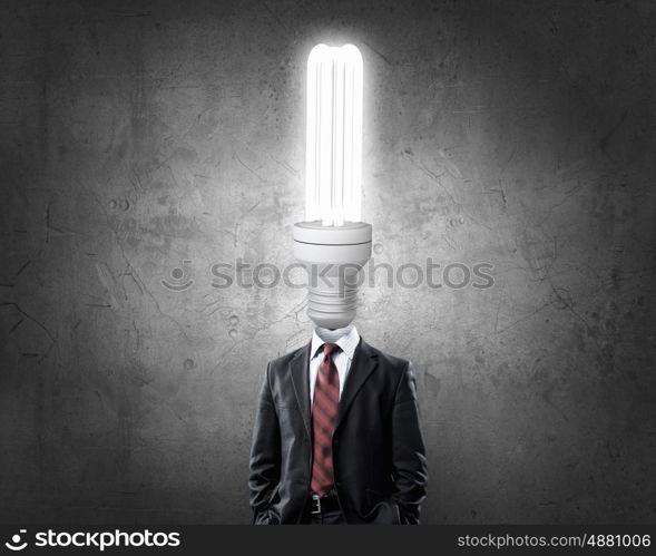 Great mind. Businessman with light bulb instead of head