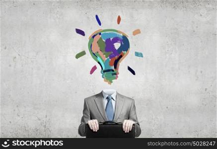 Great mind. Businessman with light bulb instead of head