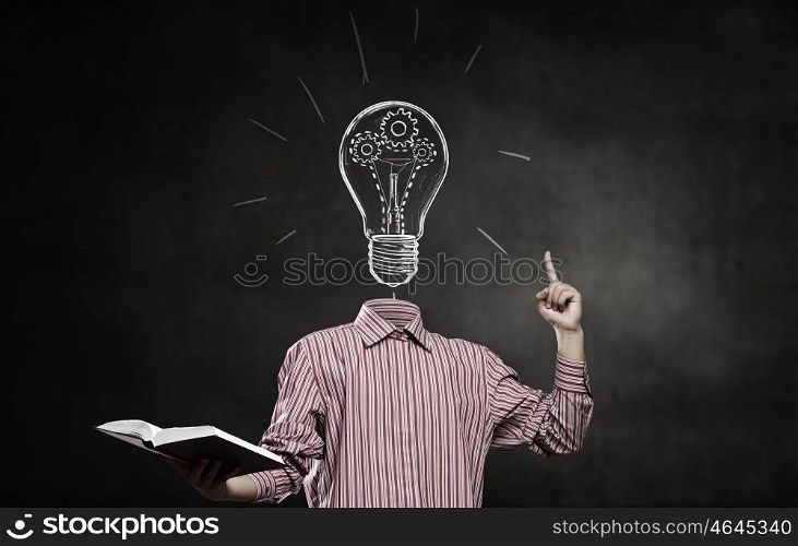 Great mind. Businessman without head holding book in hand
