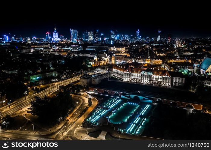 Great panoramic night view of the center and the Old City of Warsaw - Stare Miasto - from the right bank of the Vistula River. Palace of Culture City center. Aerial