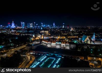 Great panoramic night view of the center and the Old City of Warsaw - Stare Miasto - from the right bank of the Vistula River. Palace of Culture City center. Aerial