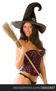 great smile of beautiful sensual brunette with a witch hat and broom