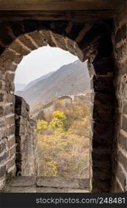 Great Wall of China at Mutianyu viewed through doorway of watchtower. Great Wall of China at Mutianyu