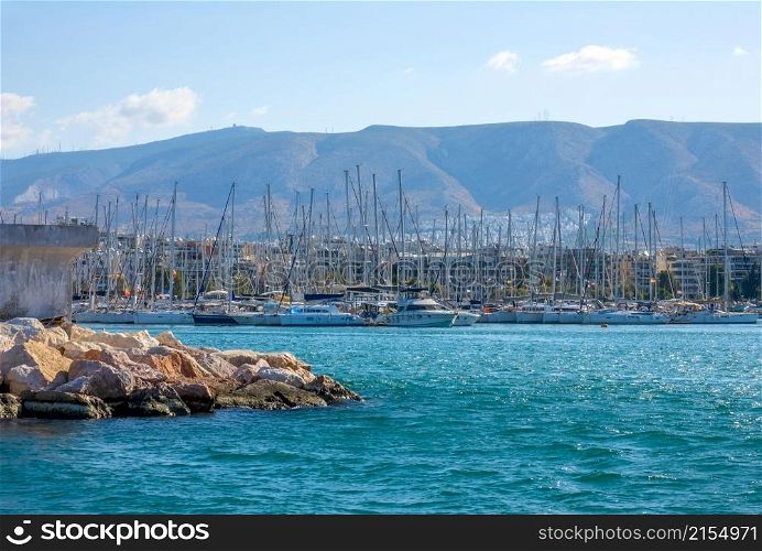 Greece. A small Mediterranean town. Lots of sailing yachts in a marina. Yacht Mooring in a Mediterranean City in Sunny Weather