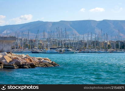 Greece. A small Mediterranean town. Lots of sailing yachts in a marina. Yacht Mooring in a Mediterranean City in Sunny Weather