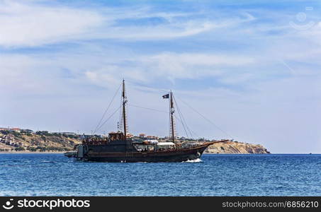 Greece, Crete, Ierapetra - 10/05/2015: Tourist ship sails along the coast