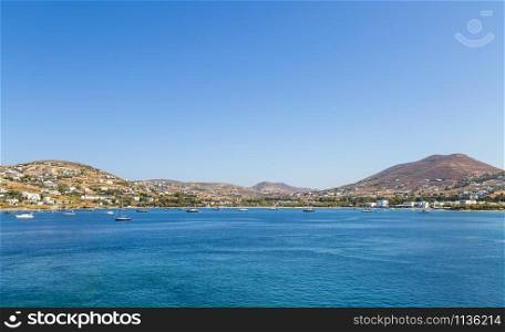 Greece. Cyclades. Paros island. Picturesque white houses near Parikia town. Yachts and boats in the sea