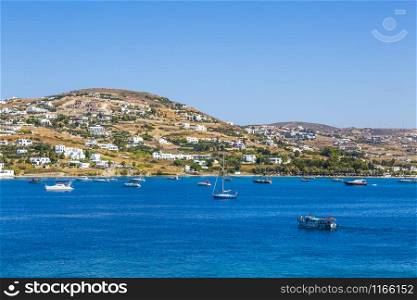 Greece. Cyclades. Paros island. Picturesque white houses near Parikia town. Yachts and boats in the sea