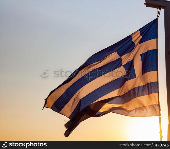 greece flag waving in sunset