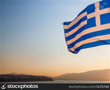greece flag waving in sunset