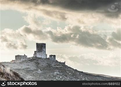 Greece Mani Peninsula. Traditional style stone tower house on hill against sky. Laconia Peloponnese, Europe. Stone old tower house on Mani, Greece.