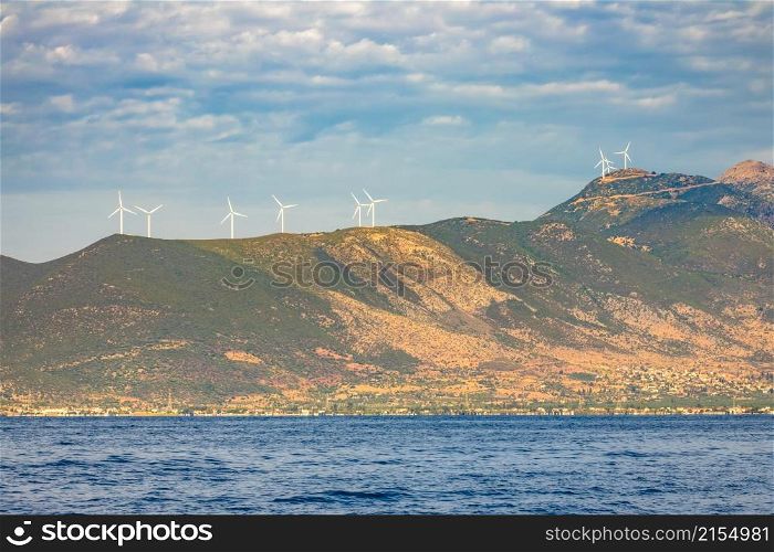 Greece. Many wind farms on the hills. Sunny Coast of the Gulf of Corinth. Wind Farms on the Hills of the Greek Coast