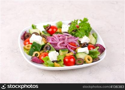 greece salad at plate isolated on a white