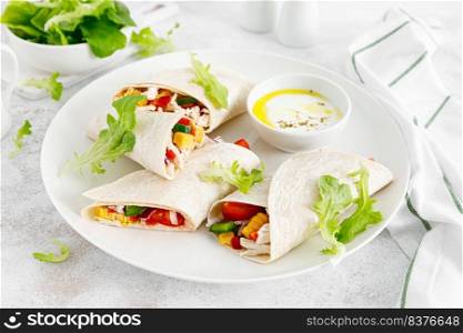 Greek chicken wraps souvlaki with vegetables and tzatziki sause