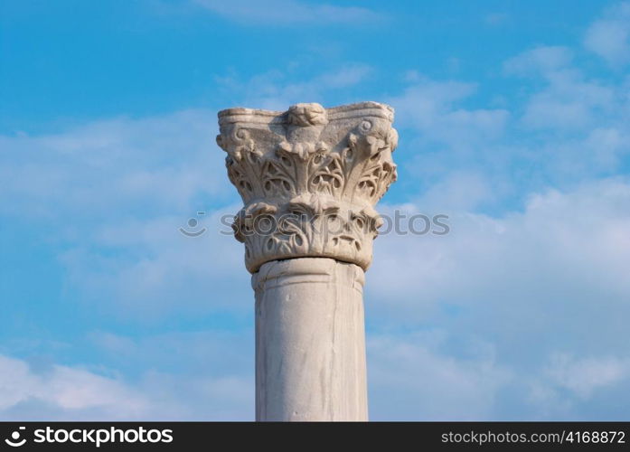 Greek column on the blue sky background