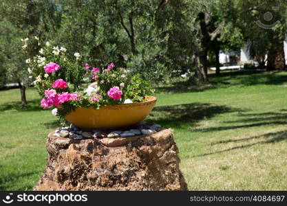 Greek garden with big earthenware jar