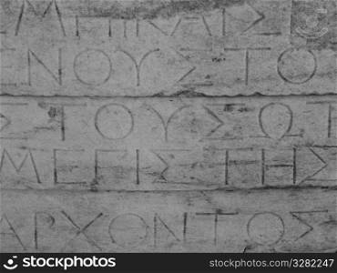 Greek lettering on ancient ruins in Athens Greece