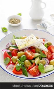 Greek or horiatiki salad with fresh vegetables and feta cheese, dressed with olive oil, traditional Greek cuisine salad