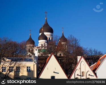 Greek Orthodox cathedral of Alexander Nevsky in Tallinn Estonia over the tops of old houses and the town wall