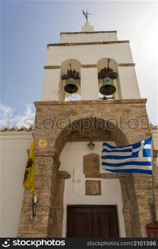 Greek Orthodox church with stone bell tower in the historic traditional settlement of Chora, the capital of Kythira island in Greece.. Greek Orthodox church with stone bell tower in the historic traditional settlement of Chora, the capital of Kythira island in Attica Greece.