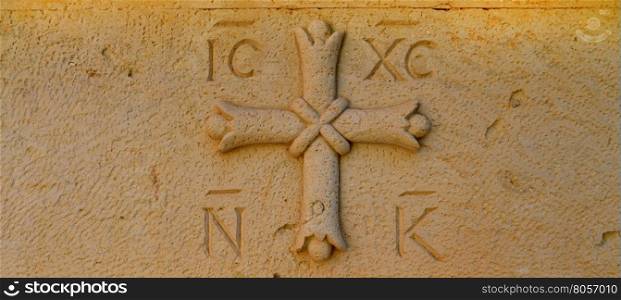 greek othodox cross religious symbol carved in stone