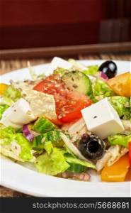 Greek salad from feta cheese, olive and vegetables