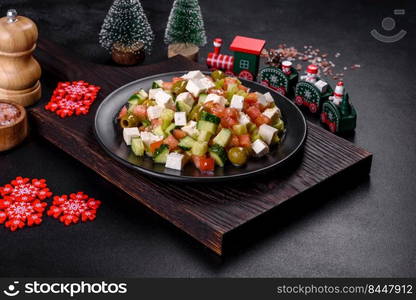 Greek salad of fresh cucumber, tomato, sweet pepper, lettuce, red onion, feta cheese and olives with olive oil. Greek salad with juicy tomatoes, feta cheese, lettuce, green olives, cucumber, red onion and fresh parsley