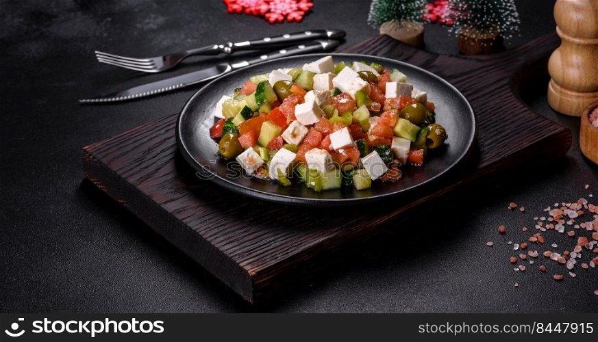 Greek salad of fresh cucumber, tomato, sweet pepper, lettuce, red onion, feta cheese and olives with olive oil. Greek salad with juicy tomatoes, feta cheese, lettuce, green olives, cucumber, red onion and fresh parsley